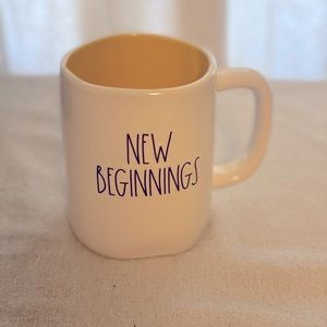 Rae Dunn New Beginnings mug with yellow interior